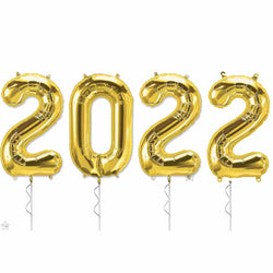 2022 number balloons shown in gold