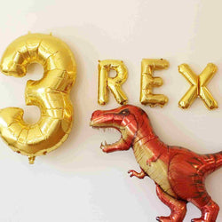 3 rex balloon kit with number 3 and rex letter balloons in gold and a growing t-rex shaped balloon