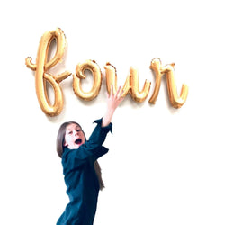 four balloons in gold script letters