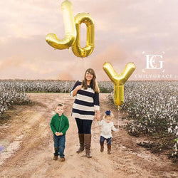 Joy Balloons shown in gold