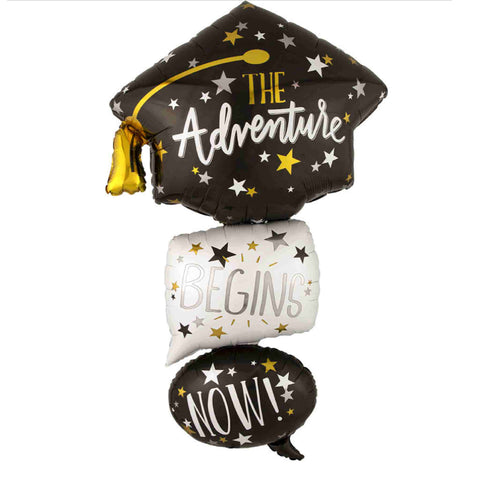 Grad Cap Balloon in black, silver and gold with bubbles that read: "The adventure begins now"