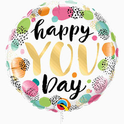 18 Inch round "Happy You Day" balloon with a printed message in gold and black with colorful confetti dots