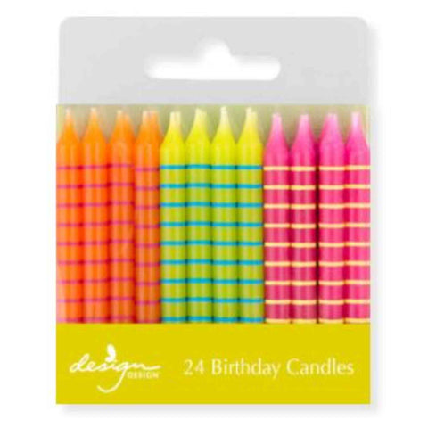 Bright striped birthday candles in orange, yellow and pink 