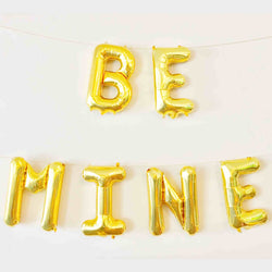 be mine letter balloons shown in gold color