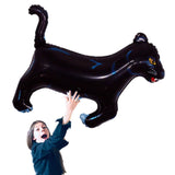 girl holding black panther wild cat balloon