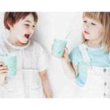 Girls holding Cactus print paper cups in mint green with white and metallic gold cactus print