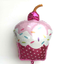 Pink cupcake foil balloon with sprinkles a maraschino cherry on top