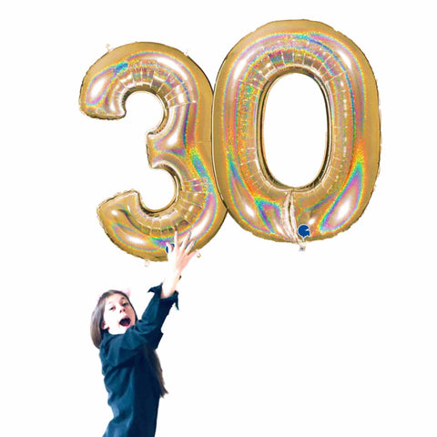 Girl holding large glitter gold Number 30 Balloons 40 IN Tall (100cm)