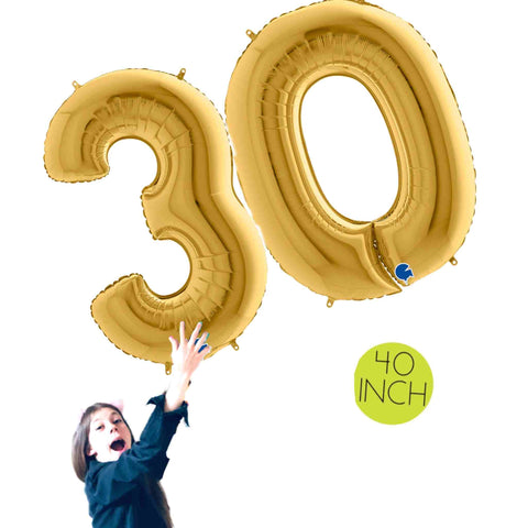 Girl holding large Gold Number 30 Balloons 40 IN Tall (100cm)