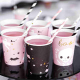 Halloween paper cups in black and pink printed with ghost, bats, skeletons