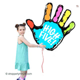 girl holding high five birthday balloon