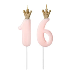 Number 16 birthday cake candles in light pastel pink and a sparkly glitter gold crown