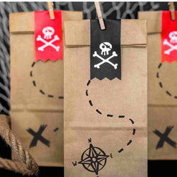 Pirate treat bags in treasure hunt printed kraft paper with cross bone sticker closures