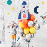 space party featurinng balloons and rocket pinatas