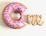 Sweet ONE Birthday Balloon banner includes a pink donut balloon plus N + E letter balloons in gold 