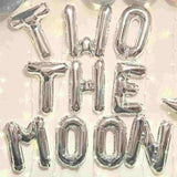 To the moon letter balloons shown in silver