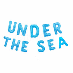 Under the sea balloon banner in blue letter balloons